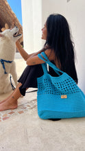 Load image into Gallery viewer, Vibrant blue cotton thread was used to crochet this bag.
